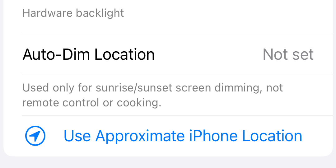 iPhone Settings tab showing the approximate location control for auto-dim screen brightness